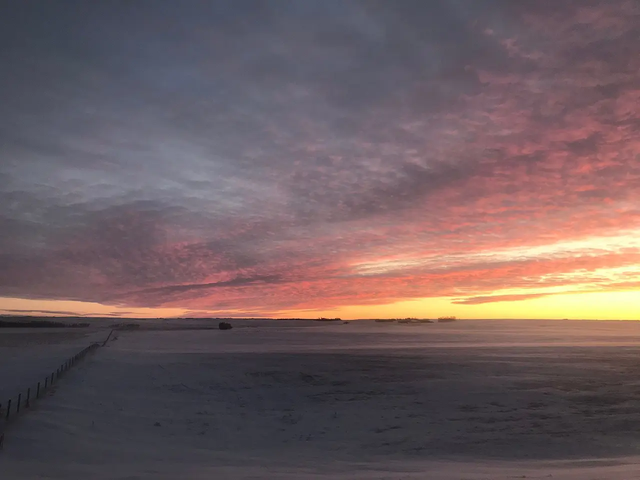 Winter prairie sunset over snowy fields, 2017